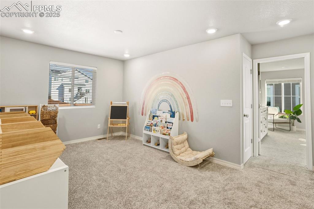 Image 20 of 37: Game room featuring light carpet and recessed lighting