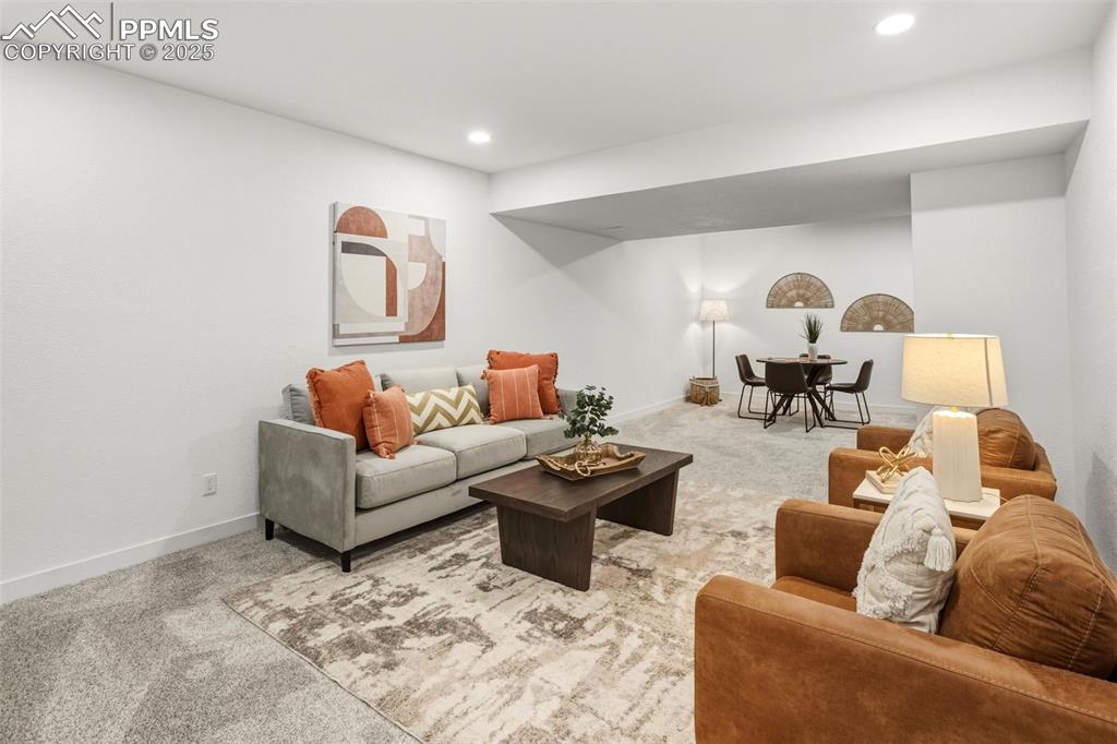 Image 28 of 37: Living room featuring carpet floors and recessed lighting