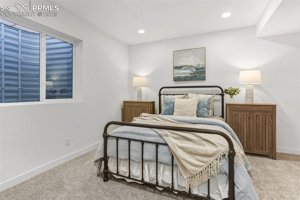 Image 31 of 37: Bedroom featuring light carpet and recessed lighting