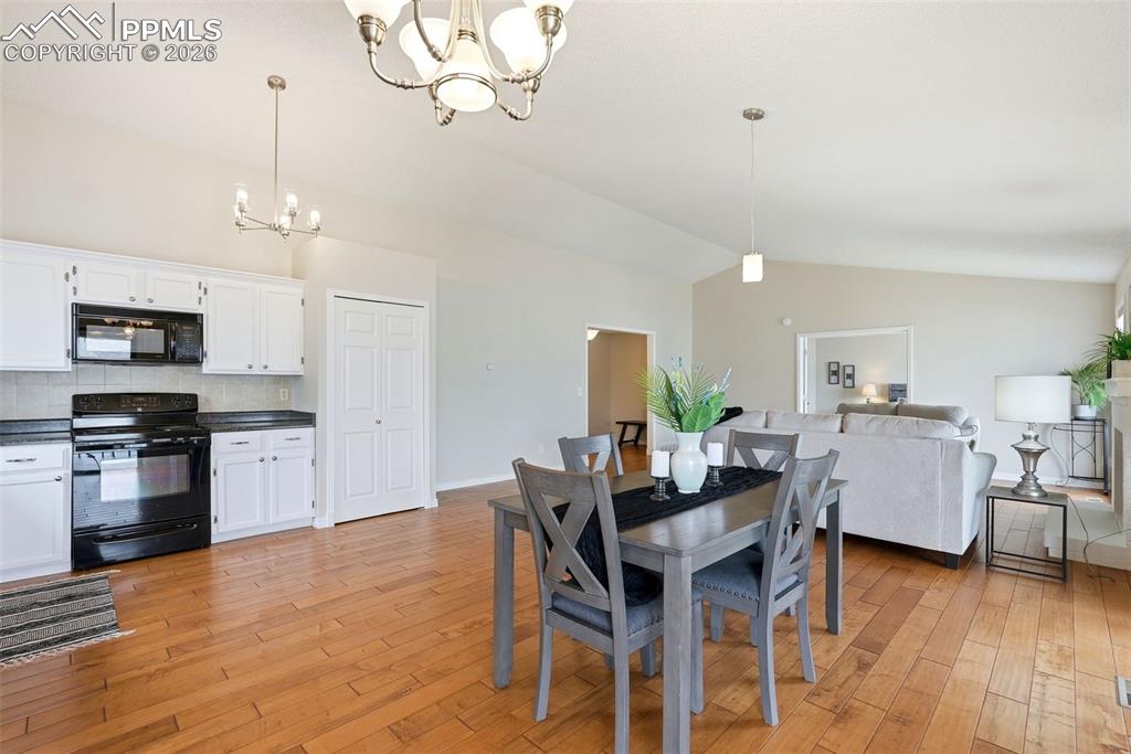 Image 10 of 44: The property features an open concept kitchen and living area, complete wit