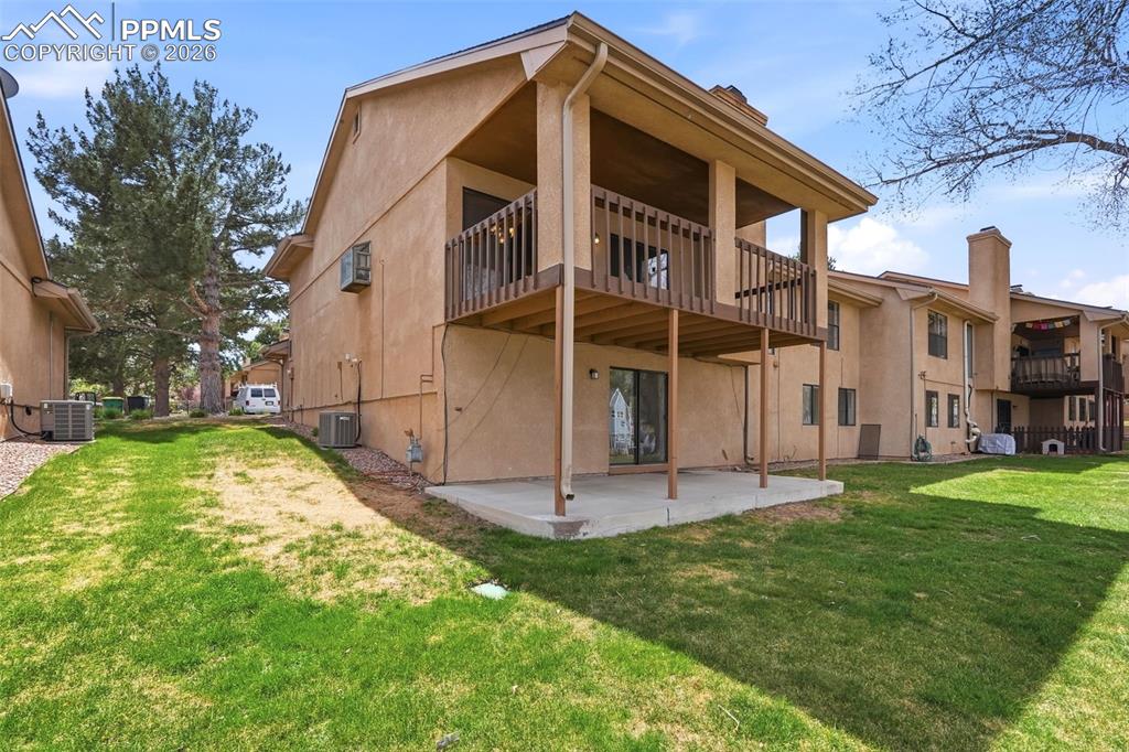 Image 33 of 44: The property features a private patio, a second-story balcony with railings
