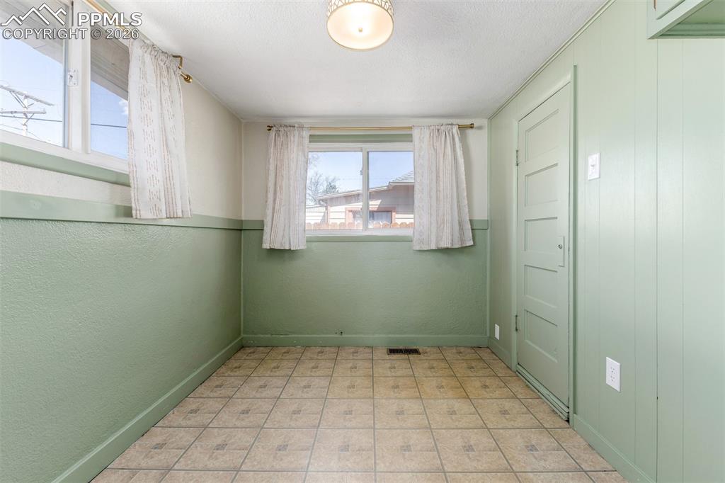 Image 19 of 40: Spare room with light flooring and baseboards