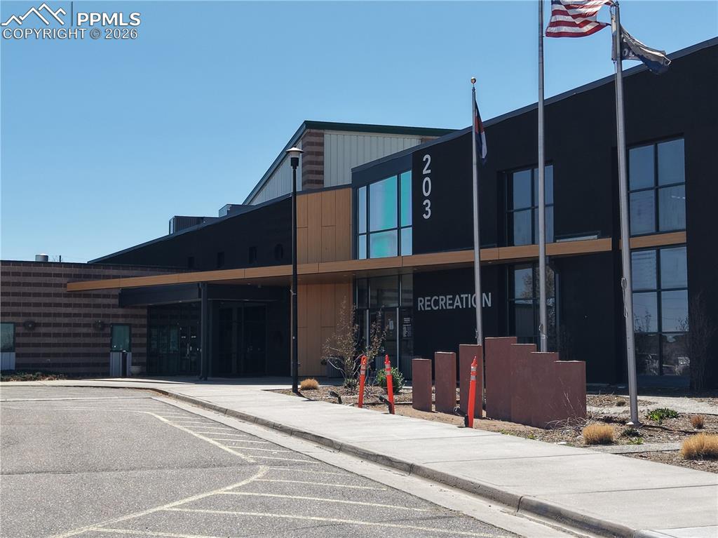 Image 32 of 40: View of property featuring uncovered parking