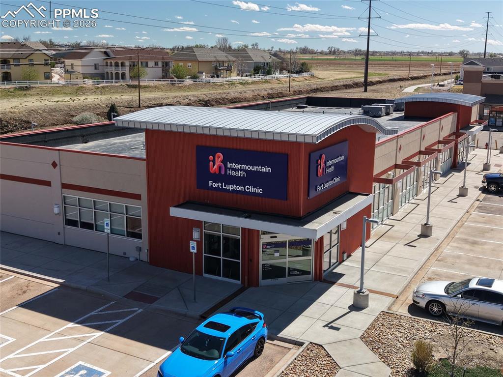 Image 39 of 40: View of property with uncovered parking
