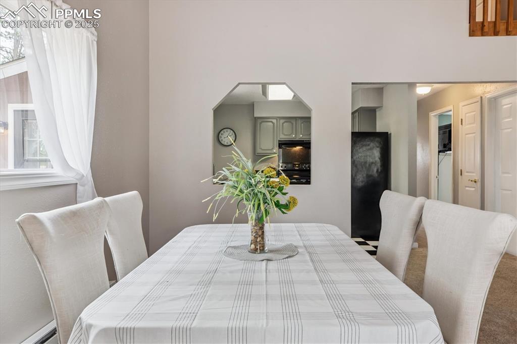 Image 11 of 29: Large dining area with room for additional seating