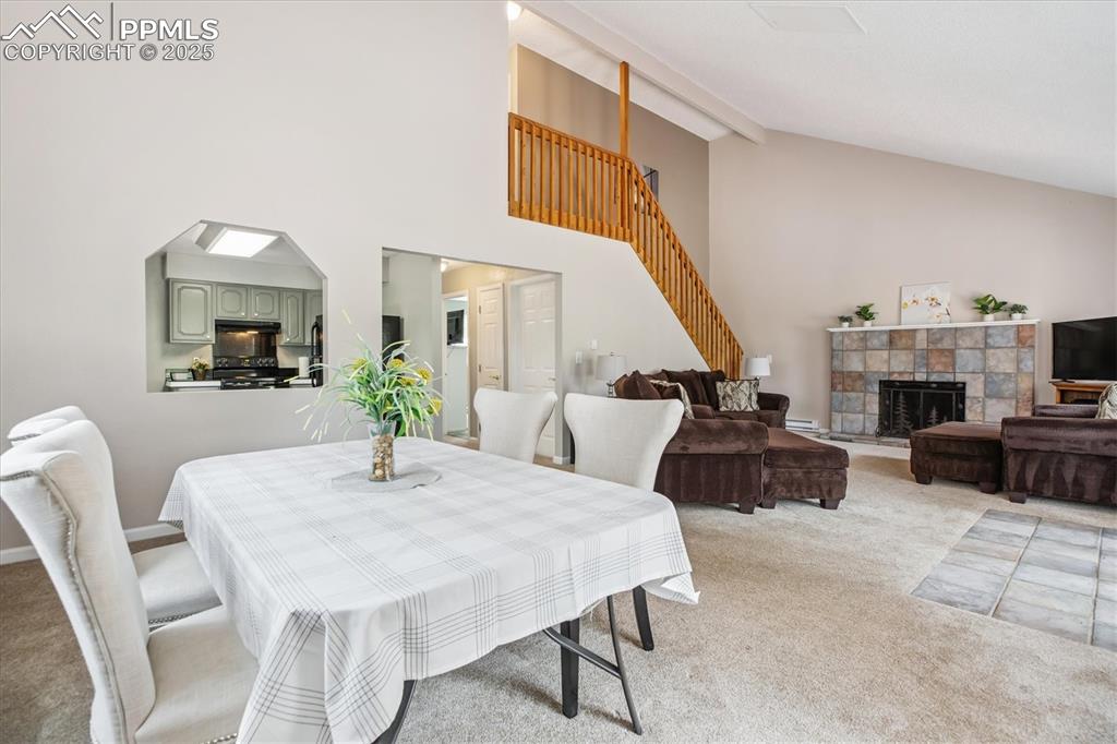 Image 9 of 29: Dining space with open floorplan and view of kitchen