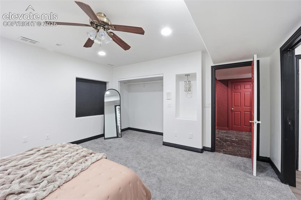 Image 22 of 49: Recessed lighting, ceiling fan with light fixture, built-in wall niche, and
