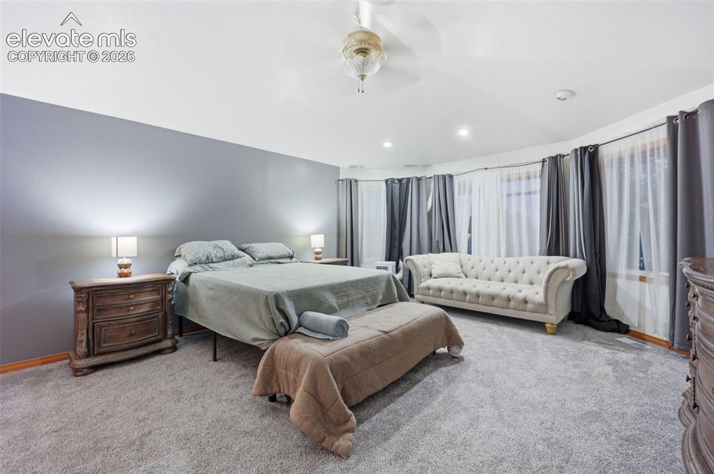 Image 26 of 49: Recessed lighting, ceiling-mounted light fixture, light gray carpeting, flo