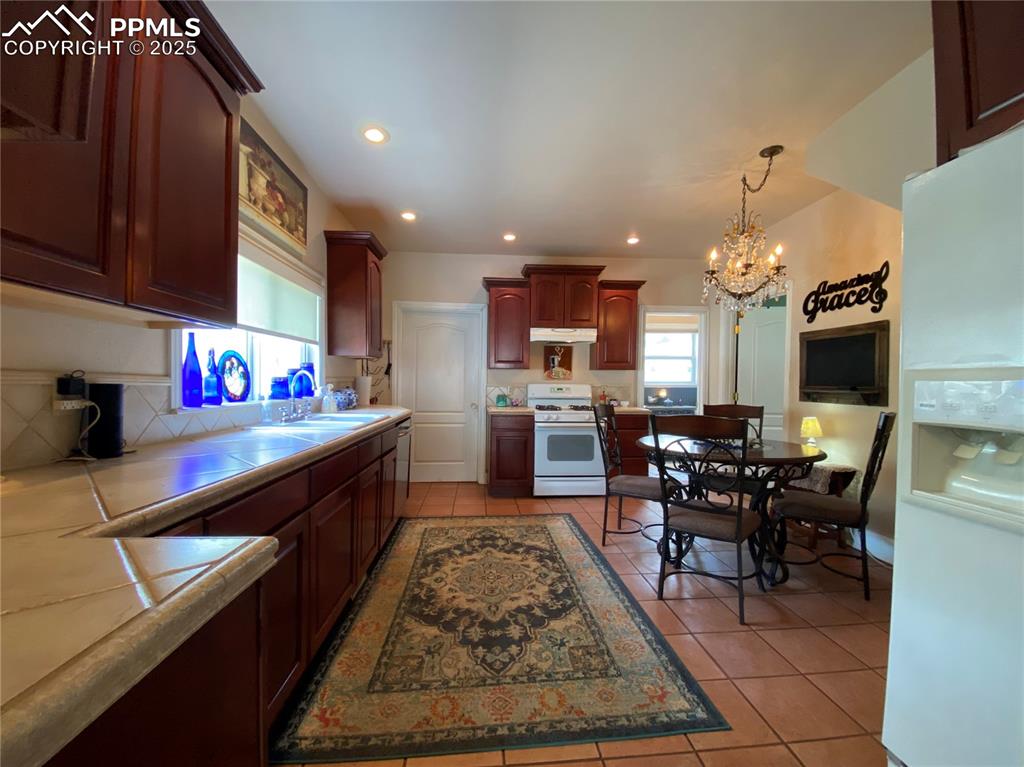 Image 12 of 36: The kitchen is perfect for gathering in