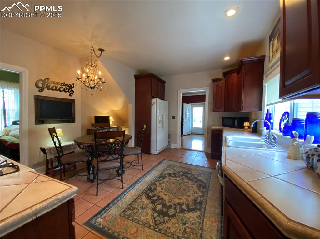 Image 16 of 36: The eat-in style provides convenience and functionality