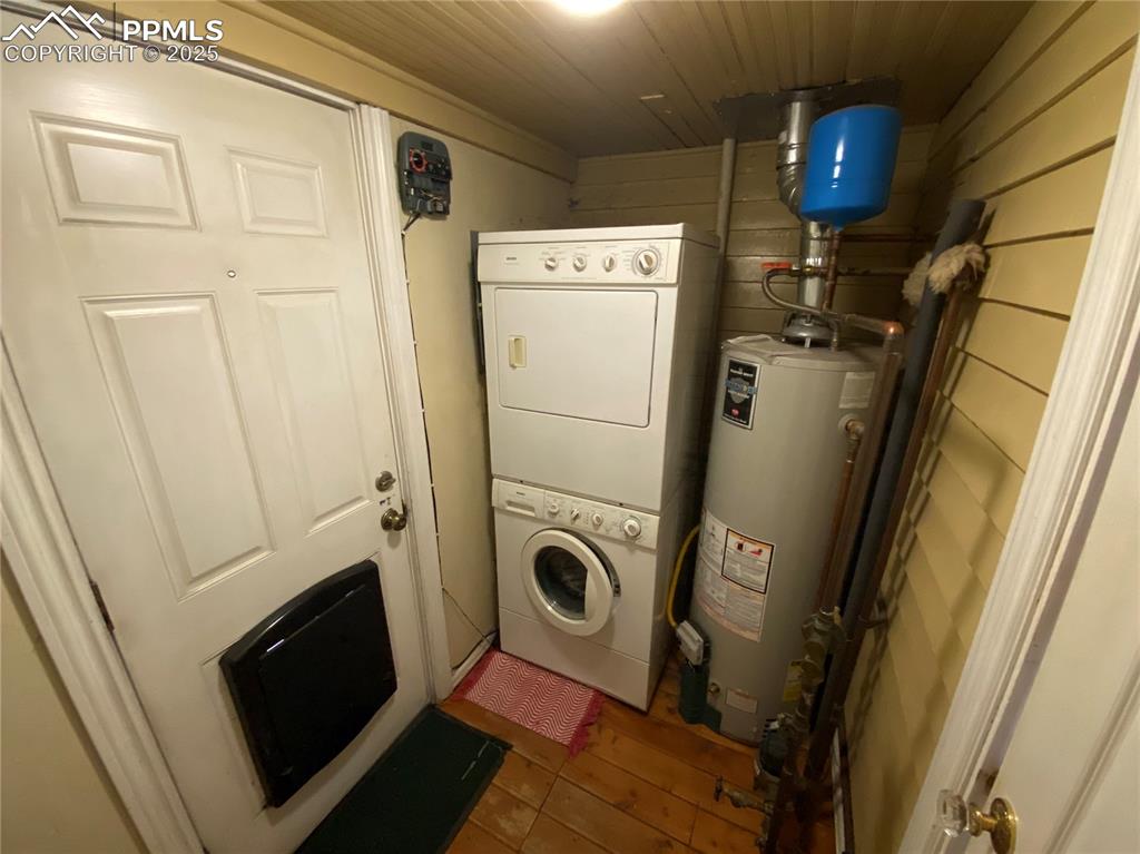 Image 24 of 36: The main-level laundry is tucked in a built-out space