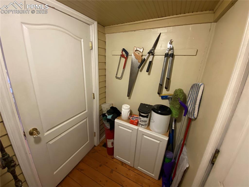 Image 25 of 36: And extra storage sits hidden next to the back door