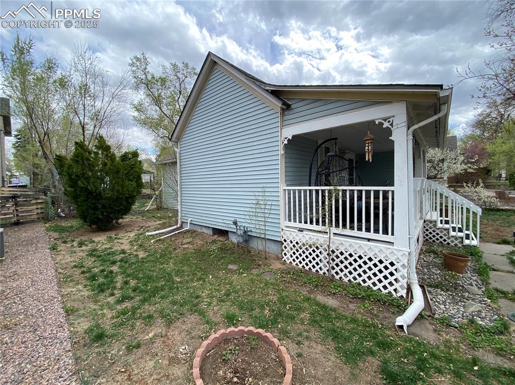 Image 32 of 36: This side yard is ready for your best ideas to utilize the space