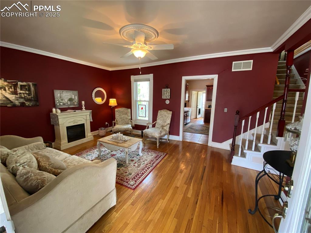 Image 5 of 36: The living room/parlor greets you with its charms