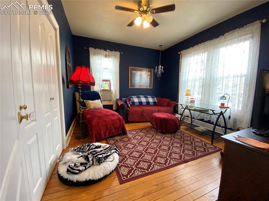 Image 9 of 36: The first of three bedrooms is just off the entry