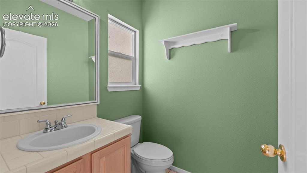 Image 3 of 28: Convenient powder room on main level