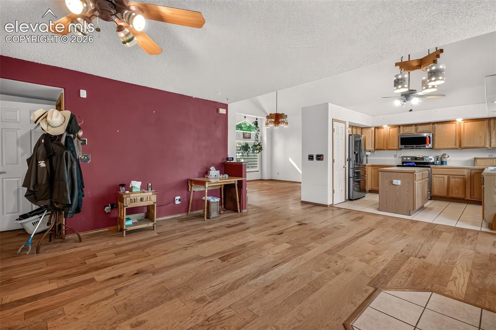 Image 15 of 41: View of Living room and Kitchen from Family room