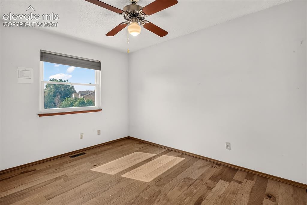 Image 22 of 41: Second Bedroom overlooking neighborhood