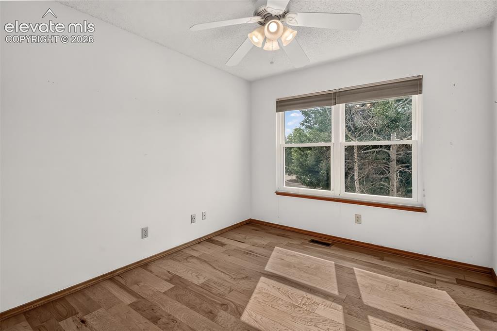 Image 23 of 41: Bright and Airy Third Bedroom