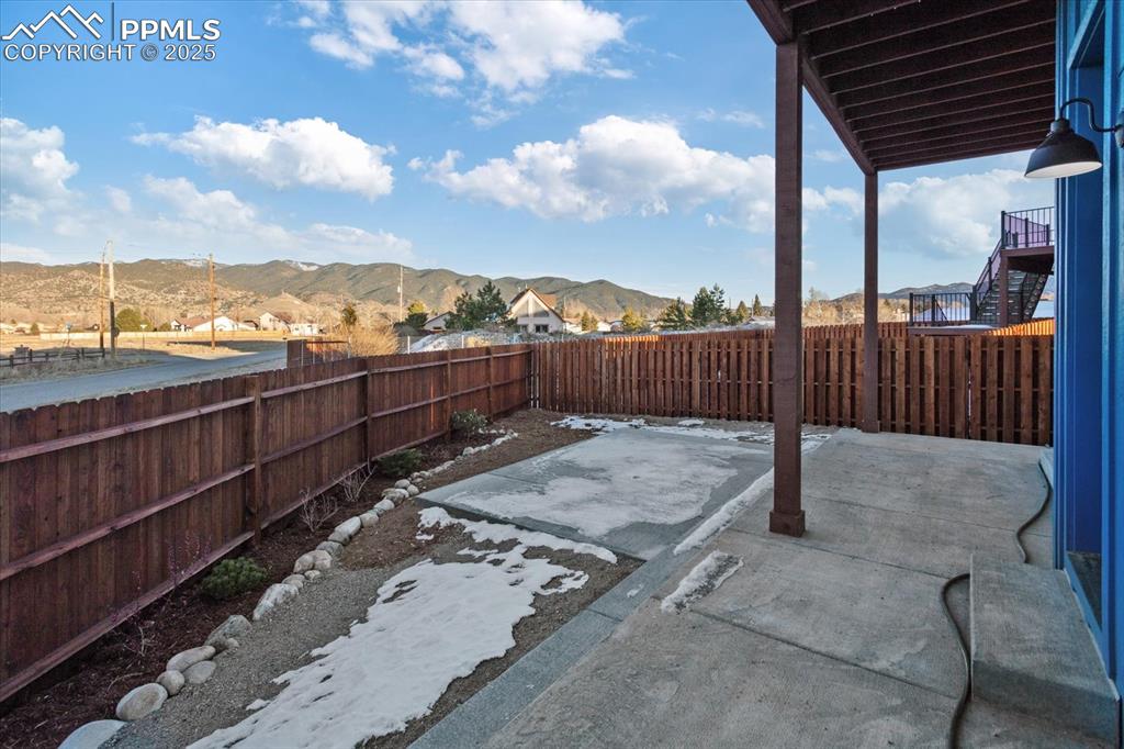 Image 24 of 30: View of patio with a mountain view
