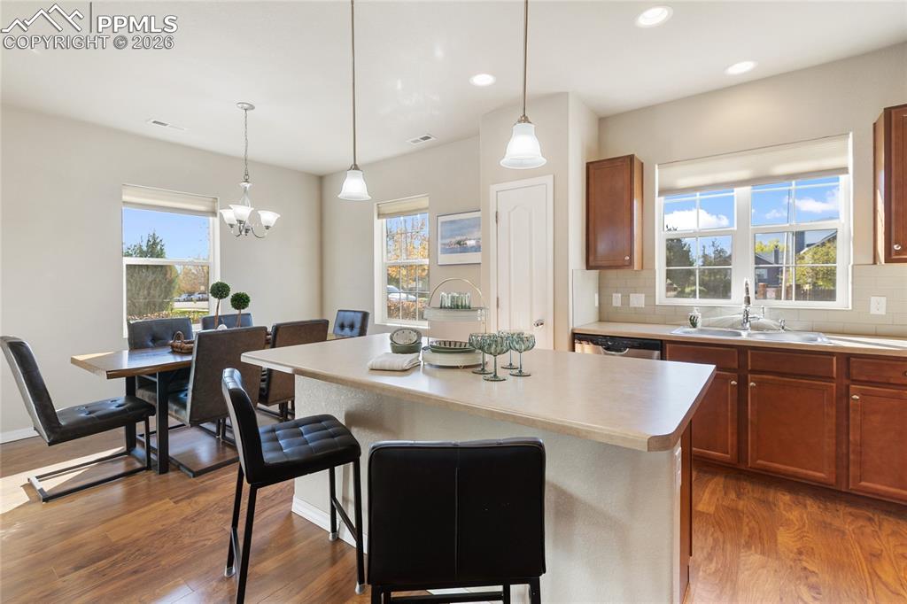 Image 9 of 27: The spacious kitching and dining area is great for cooking, entertaining...