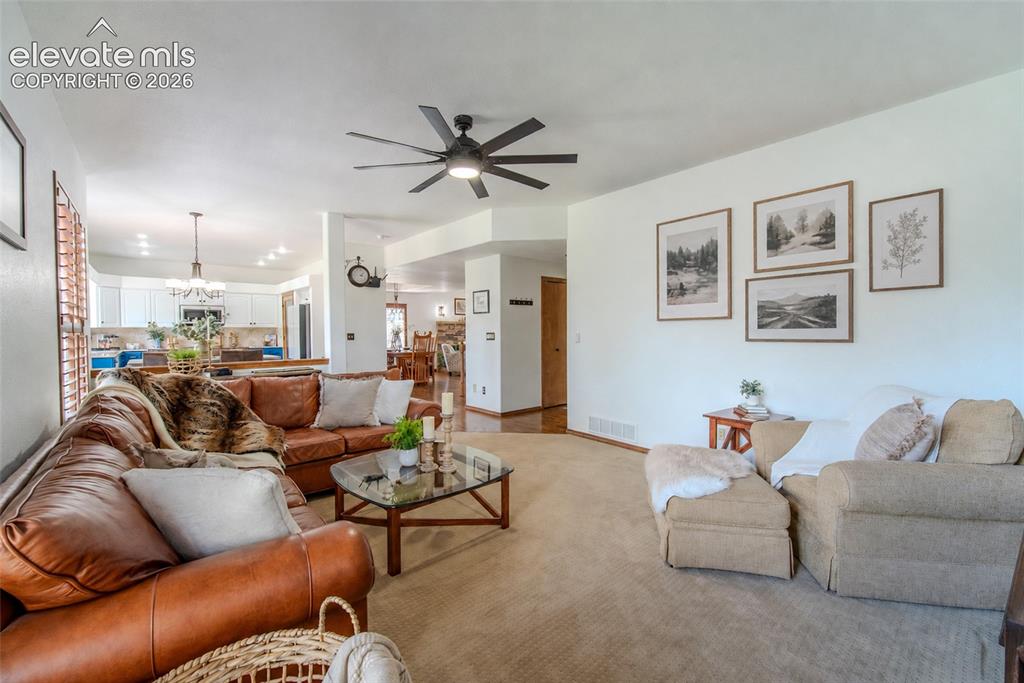 Image 20 of 44: Hallway leads to half bath, laundry room and 3 car garage access