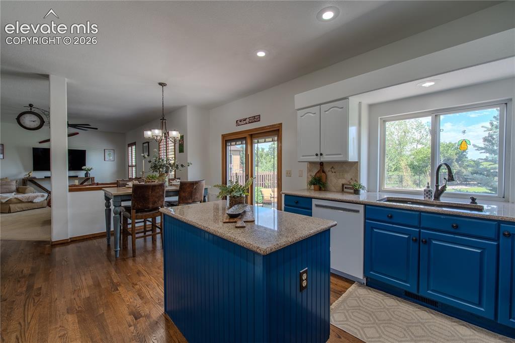 Image 21 of 44: Open concept to Family room and the flow to the backyard space through fren