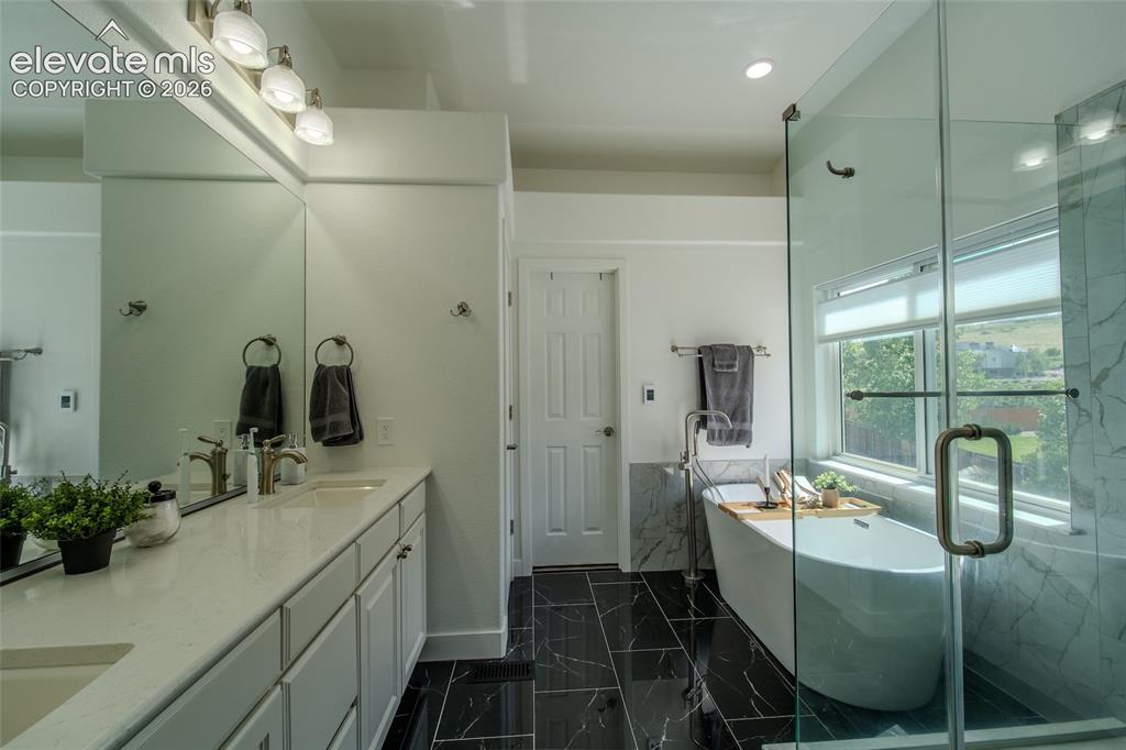 Image 28 of 44: Private water closet with large walk in closet