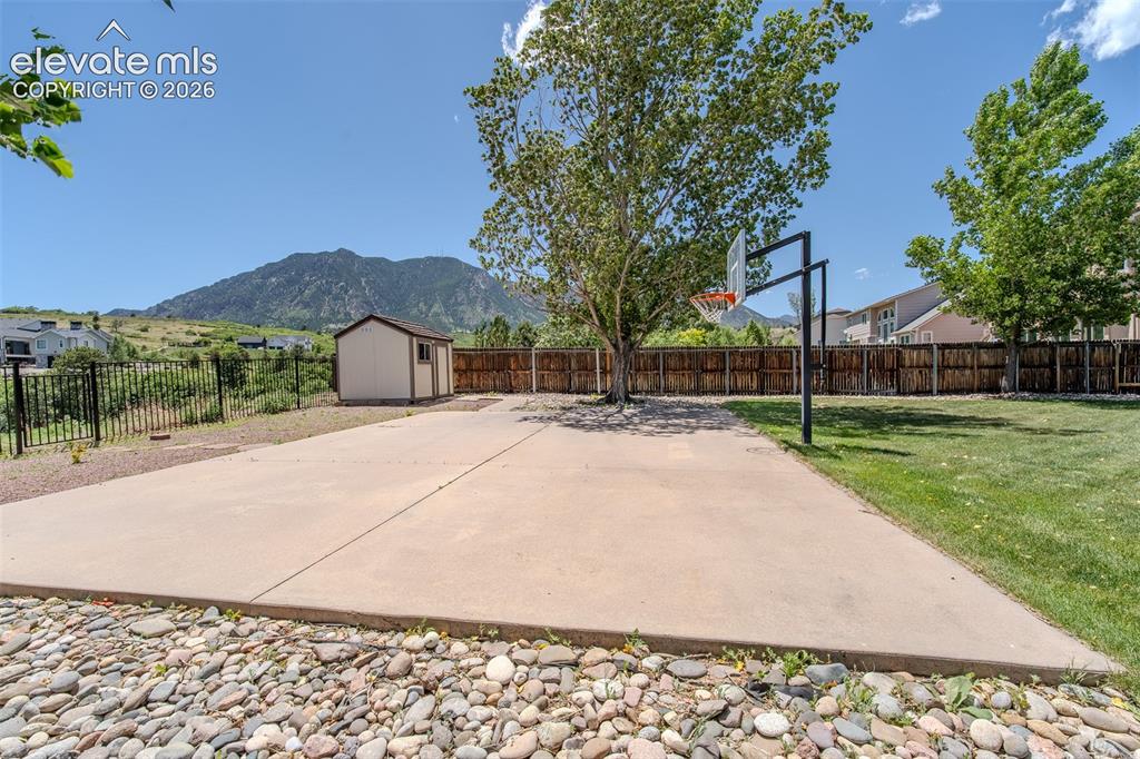 Image 9 of 44: Basketball court w/ views of open space and mountains