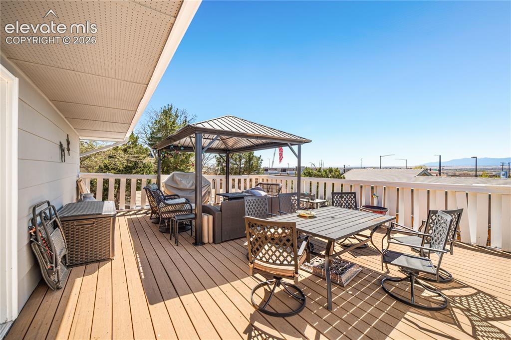 Image 28 of 50: Dedicated utility area featuring wood-finish flooring, light blue painted w