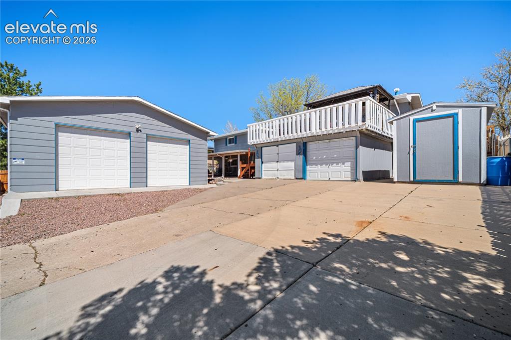 Image 30 of 50: Spacious living area featuring wood-finish flooring, a front entry door wit