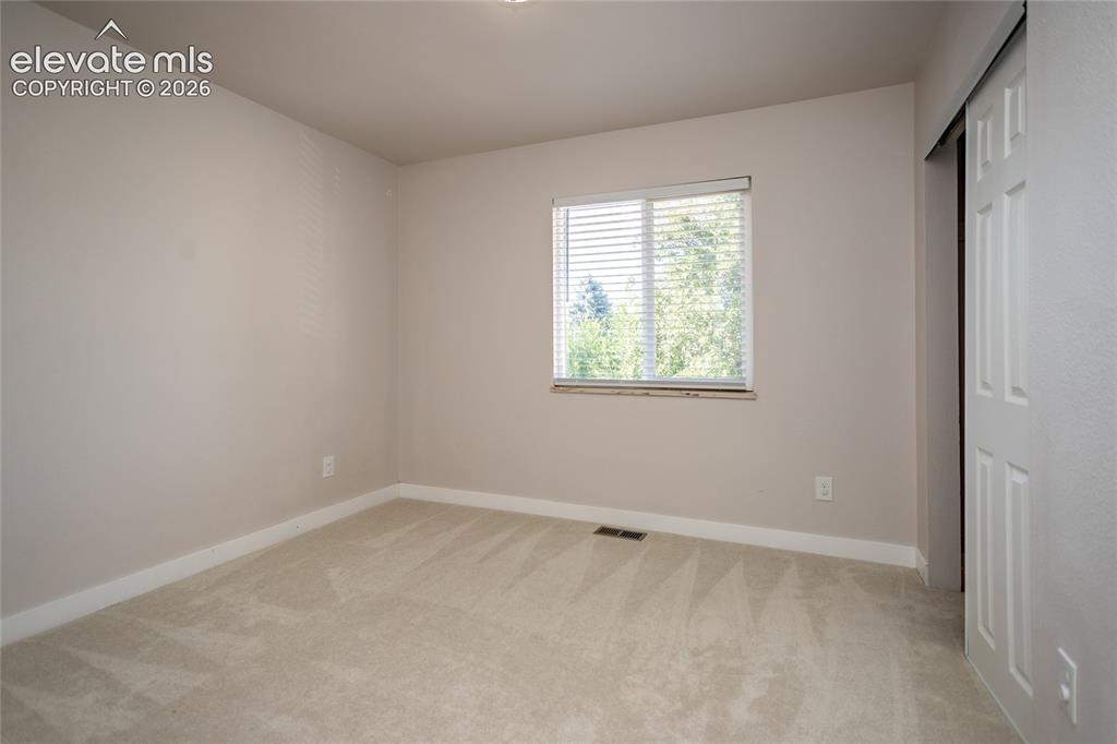 Image 10 of 25: 3rd bedroom on main level