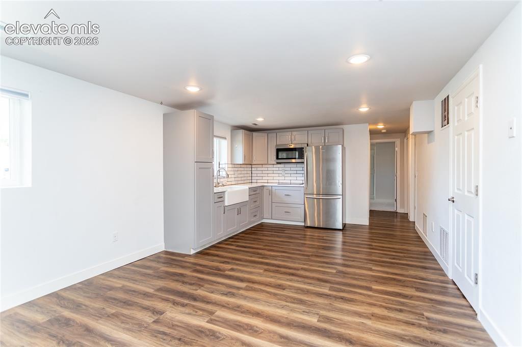 Image 12 of 25: Lower Level Kitchen and Family Room