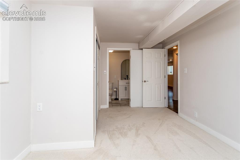 Image 15 of 25: 5th bedroom with adjoining bathroom