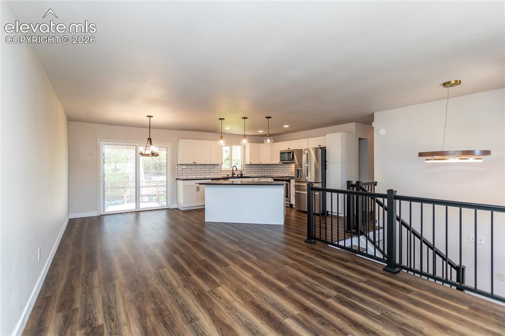 Image 3 of 25: Open Floor Plan of Dining Area, Kitchen, and Living Room