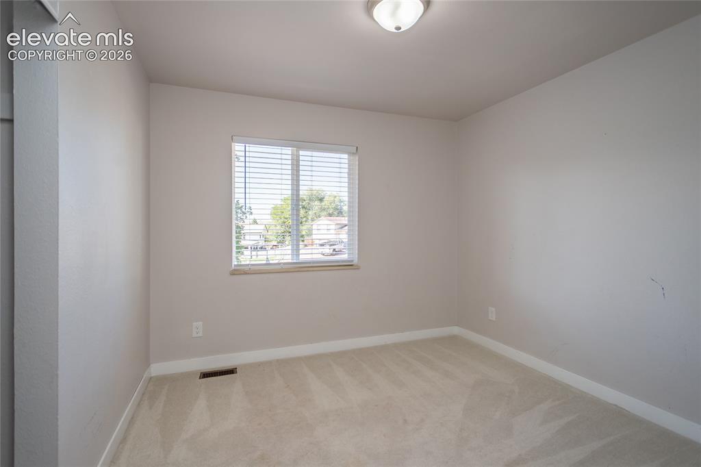 Image 9 of 25: 2nd bedroom on main level