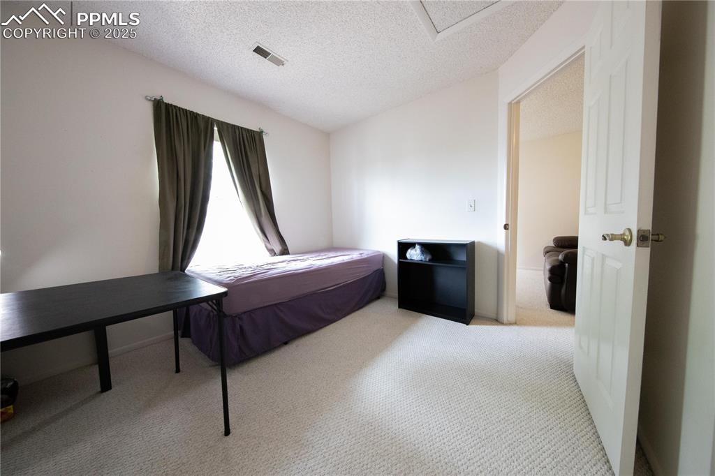 Image 14 of 19: upstairs bedroom