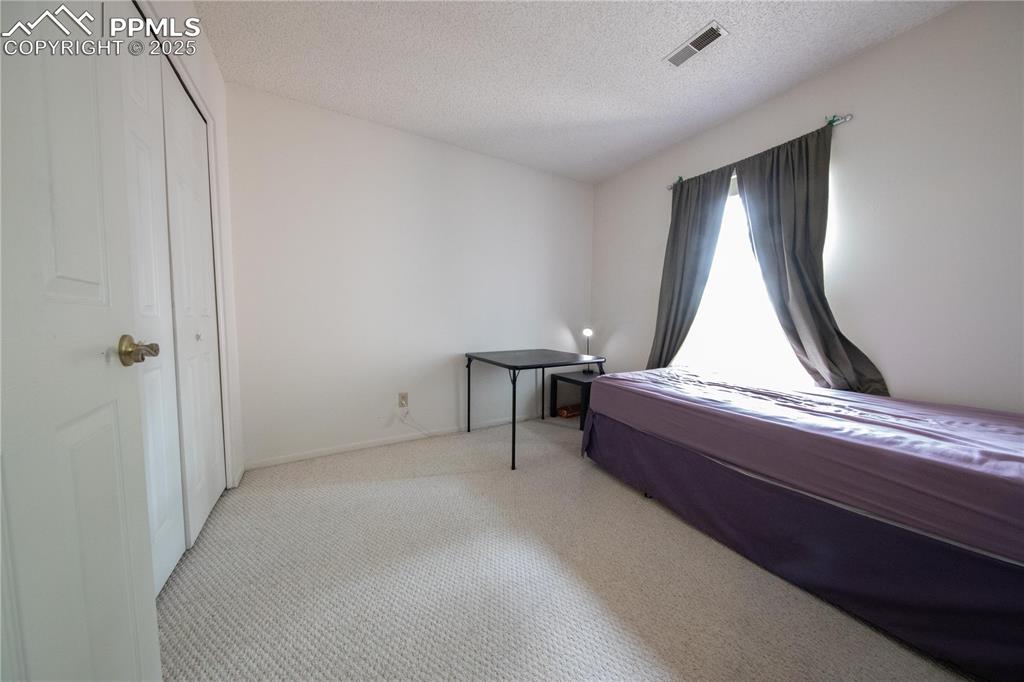 Image 15 of 19: upstairs bedroom