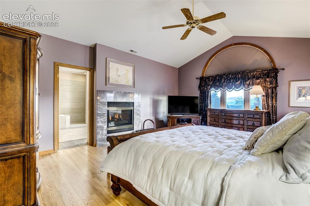 Image 17 of 49: Soaring ceilings, wood floors and a cozy gas fireplace are a perfect retrea
