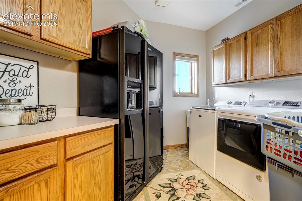 Image 29 of 49: Spacious Laundry is conveniently located on the first floor and offers plen