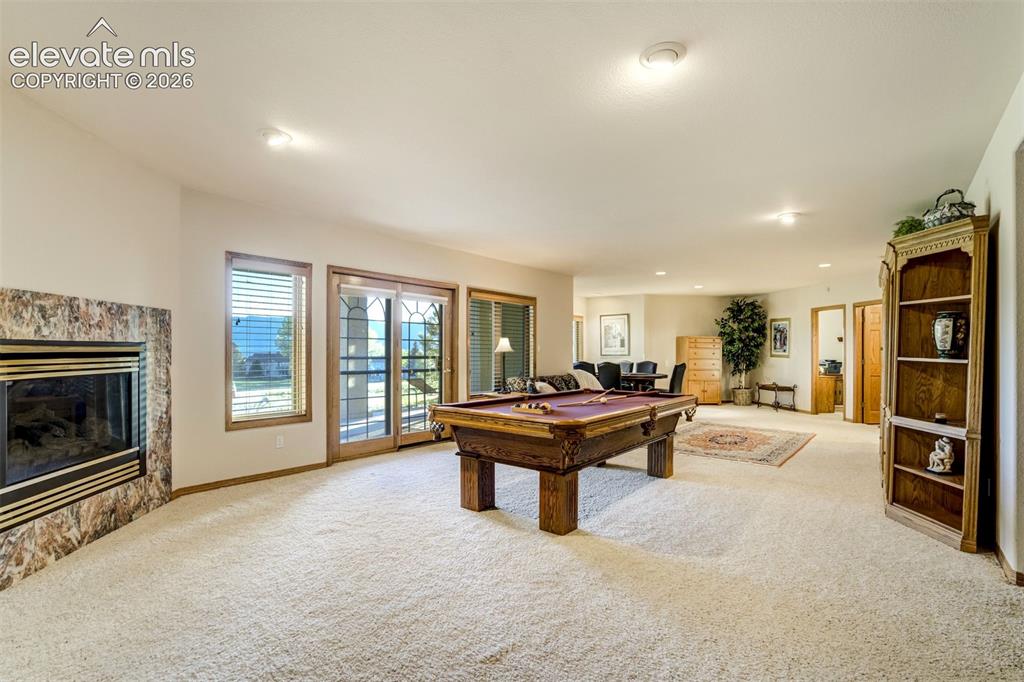 Image 33 of 49: Enjoy a cozy fireplace in the basement