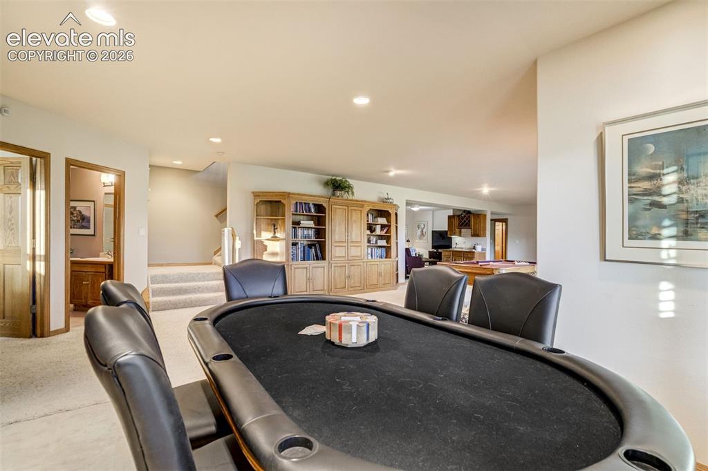 Image 35 of 49: This alcove in the basement is perect for a game table!