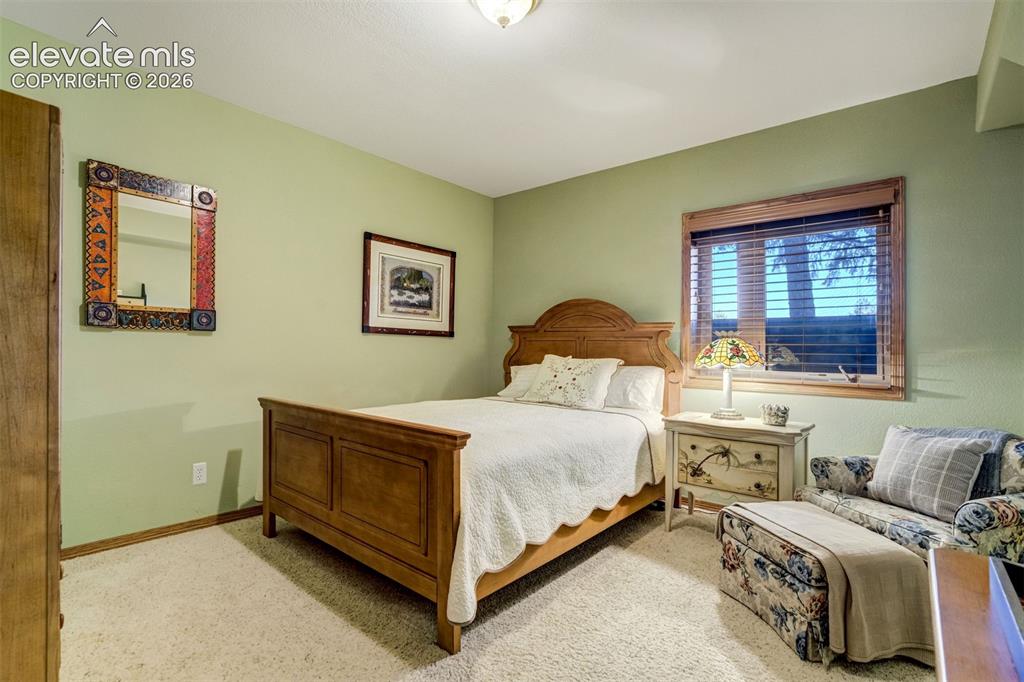 Image 40 of 49: A 3rd bedroom located in basement serves as "En-Suite" with an attached bat