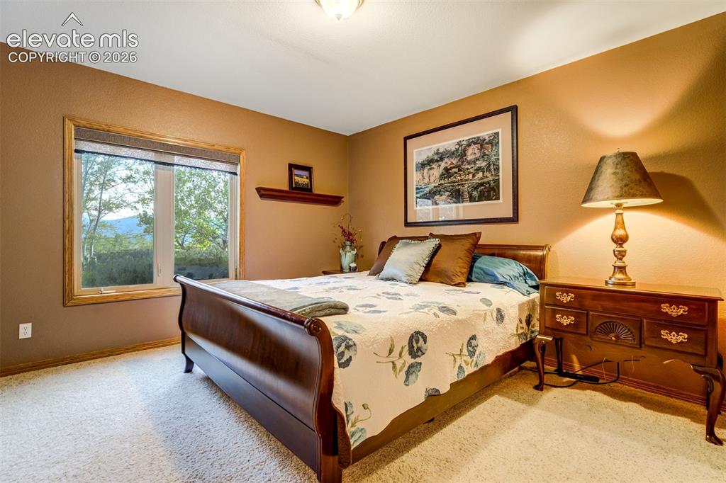 Image 42 of 49: A 4th bedroom in the basement is bright