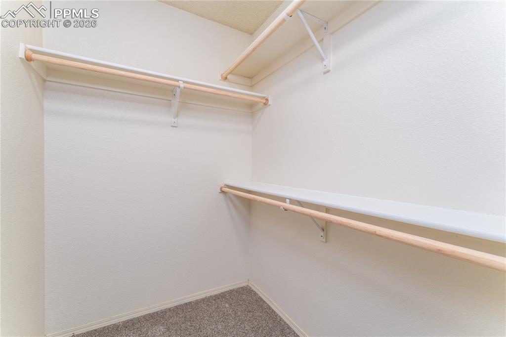 Image 12 of 44: Primary Bedroom Walk In Closet