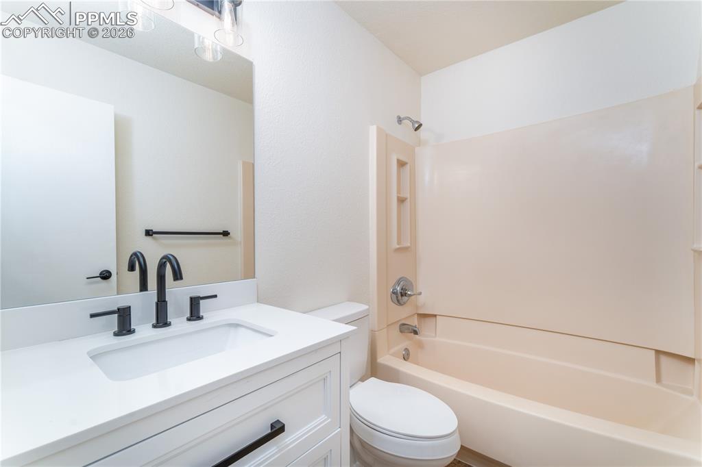 Image 13 of 44: Upstairs Hallway Bathroom