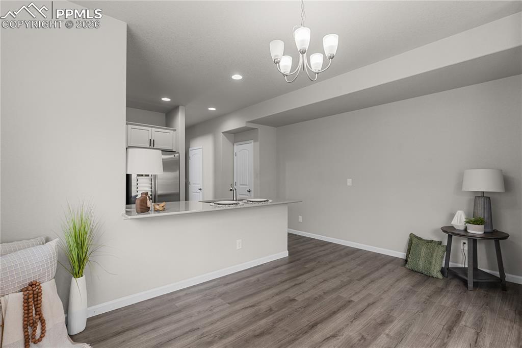 Image 10 of 26: Additional view of the dining nook with LVP.