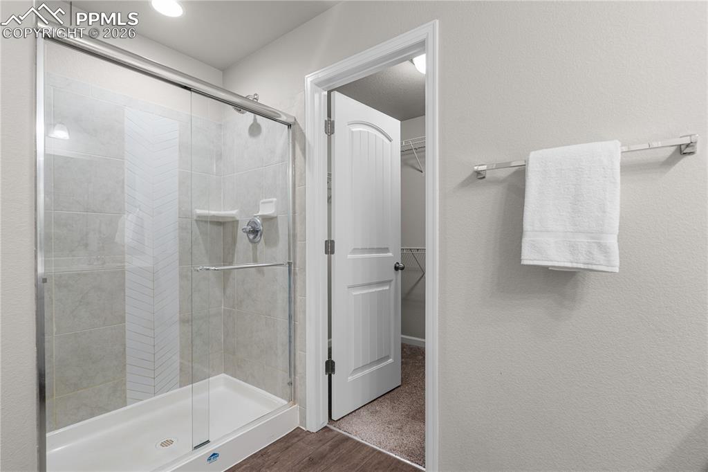 Image 21 of 26: The walk in closet completes the master suite.