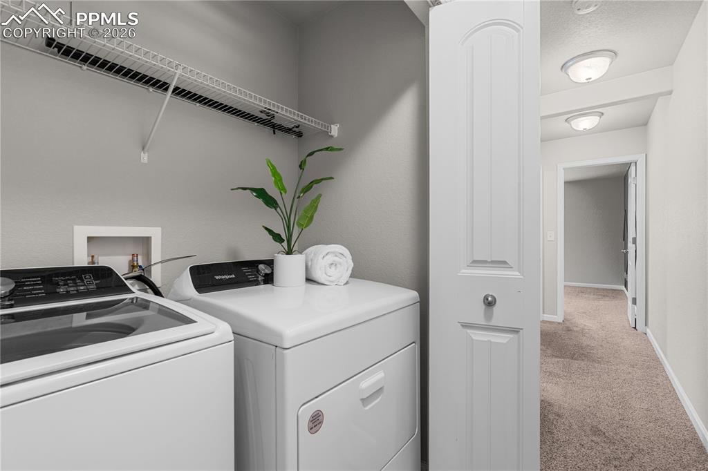 Image 26 of 26: Upper level laundry space is convenient - and makes laundry a breeze.