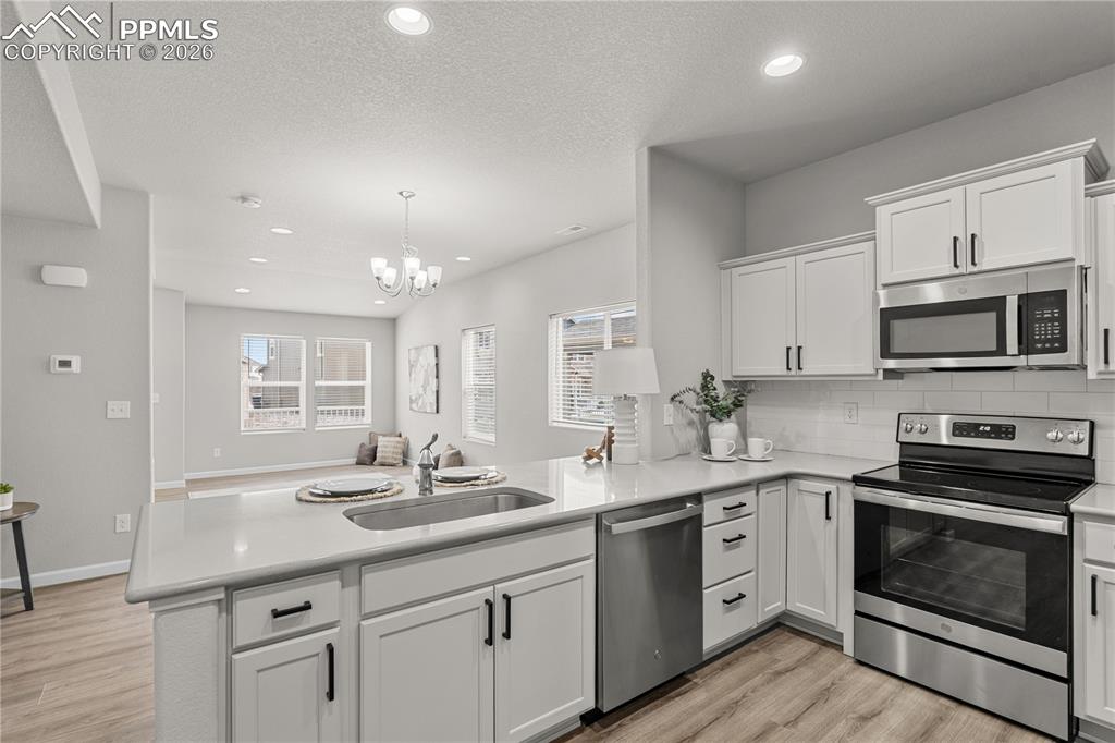 Image 8 of 26: Stunning cabinetry and an abundance of natural light.